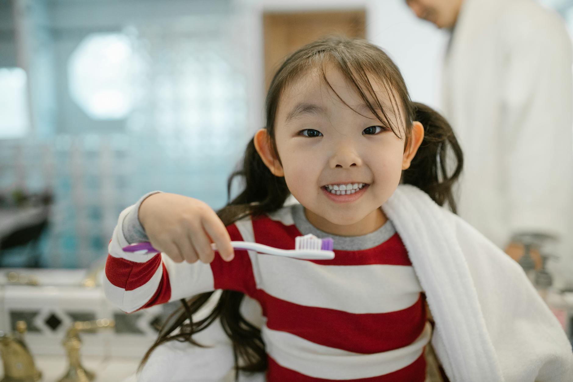 cheerful child while cleaning teeth